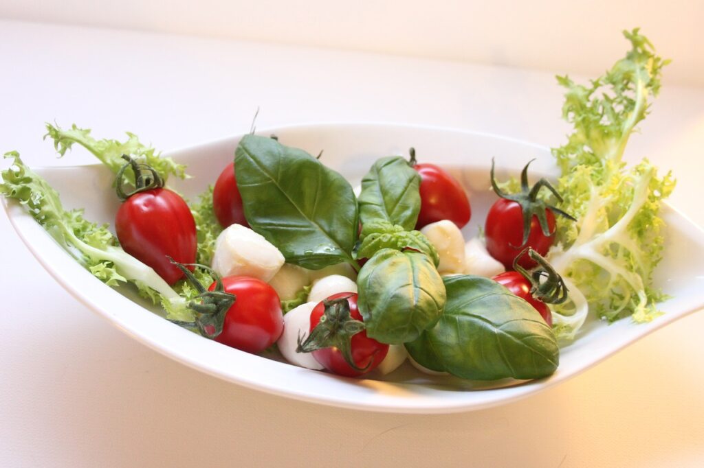 Minimalist Caprese Salad with fresh mozzarella, basil, and balsamic drizzle.