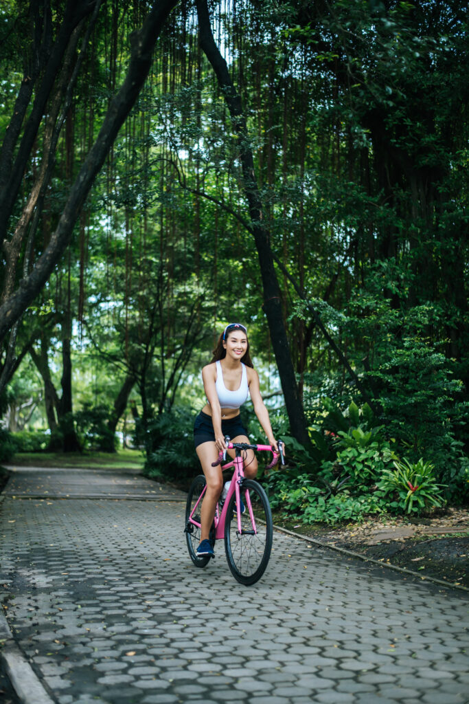 A woman commuting on an eco-friendly trail to reduce emissions.